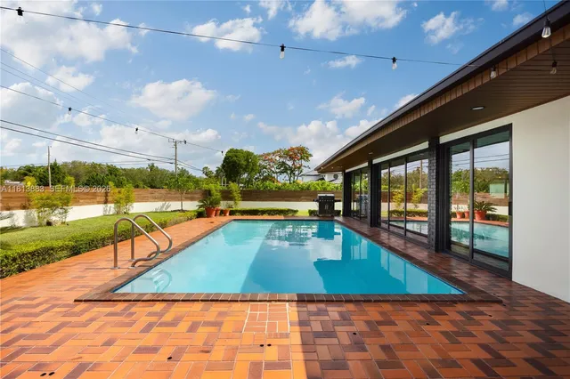 a front view of a house with a garden and a yard