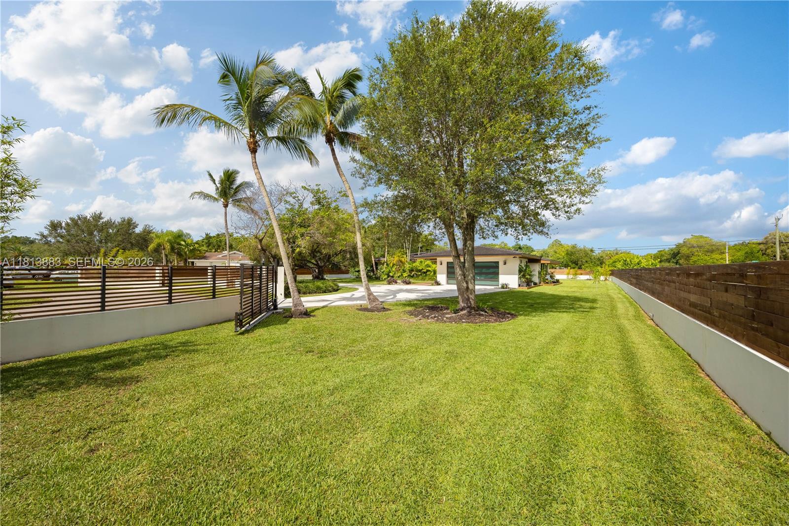 9670 Southwest 96th Court Miami, FL 33176 - Photo 40 of 45 a view of a swimming pool with an outdoor space