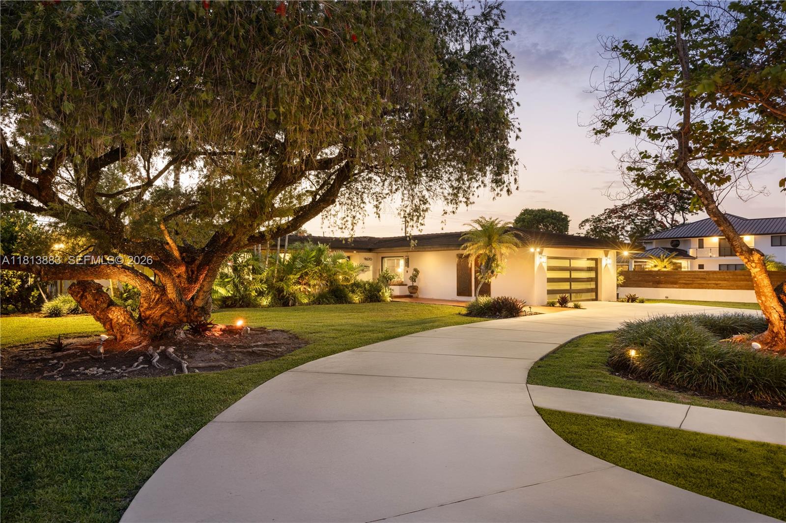 9670 Southwest 96th Court Miami, FL 33176 - Photo 41 of 45 a front view of a house with a garden and tree