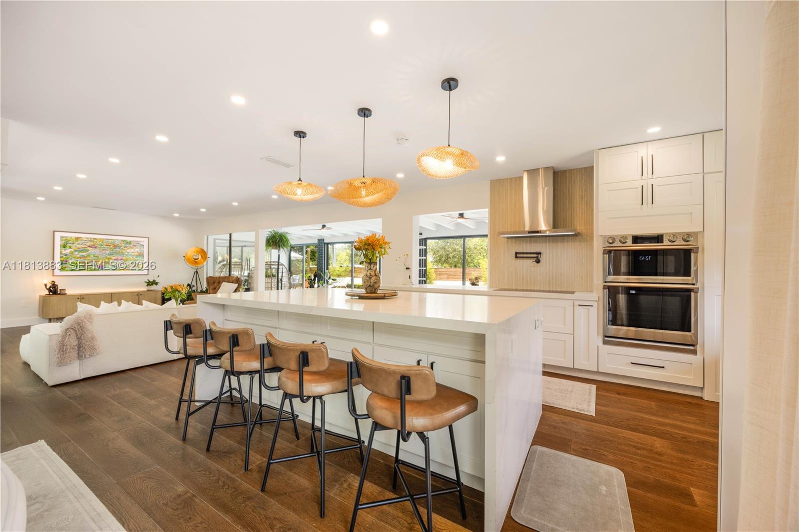 9670 Southwest 96th Court Miami, FL 33176 - Photo 5 of 45 a kitchen with stainless steel appliances kitchen island granite countertop a table chairs and a refrigerator