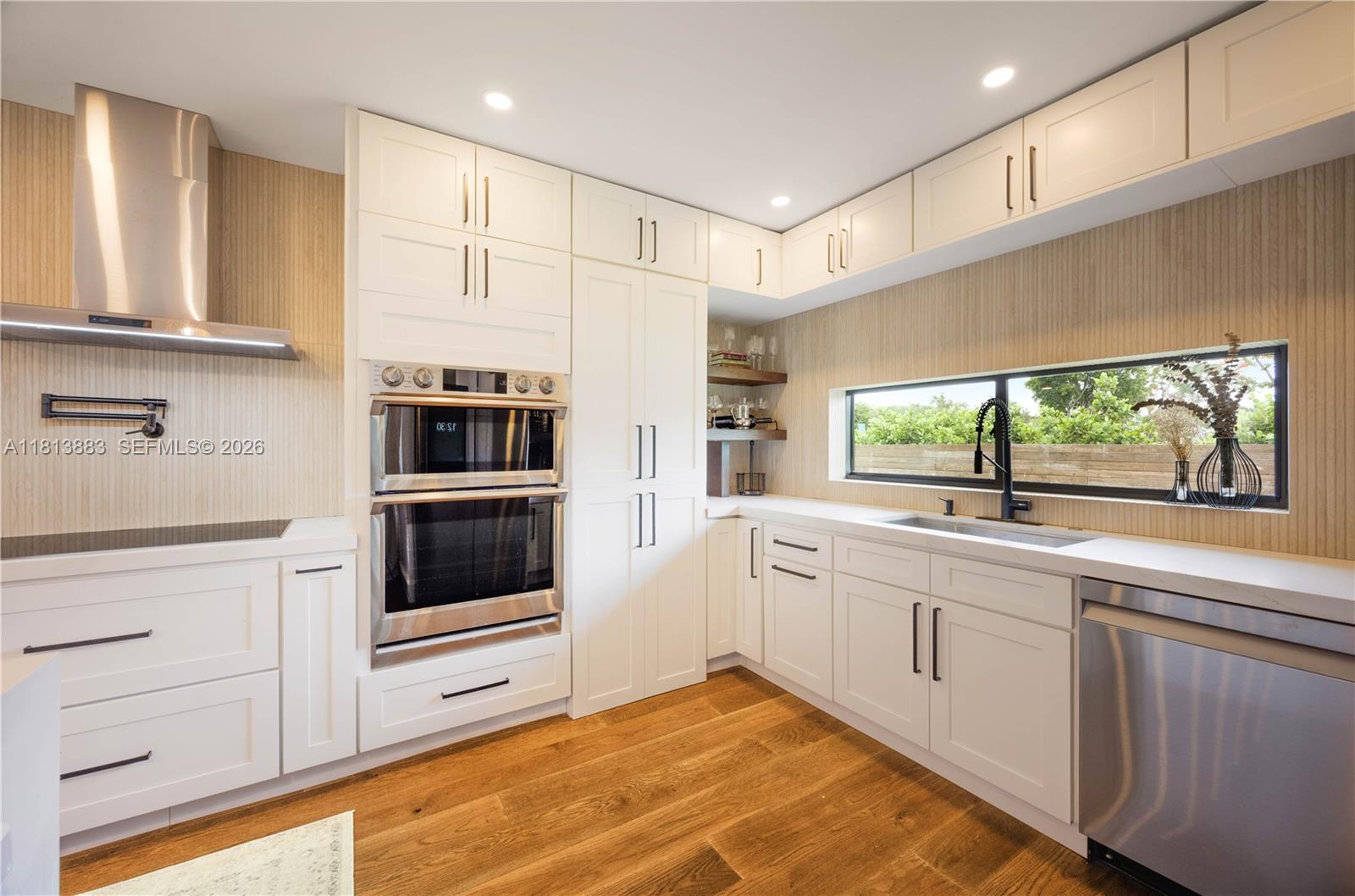 9670 Southwest 96th Court Miami, FL 33176 - Photo 7 of 45 a kitchen with stainless steel appliances a stove sink and microwave
