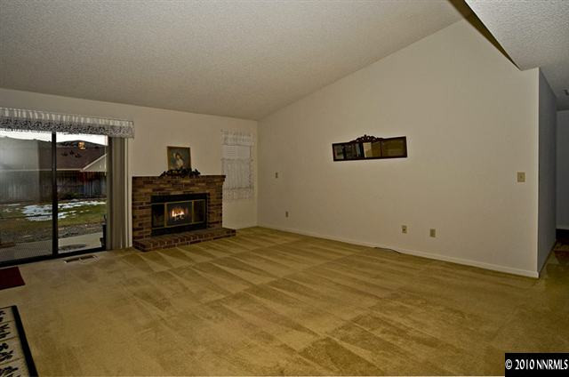 175 Lemming Drive Reno, NV 89523 - Photo 2 of 9 a view of an empty room with window and fire place