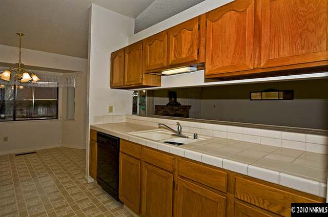 175 Lemming Drive Reno, NV 89523 - Photo 5 of 9 a kitchen with a sink and cabinets