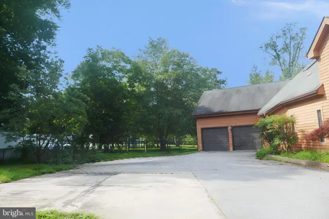 front view of a house with a garden