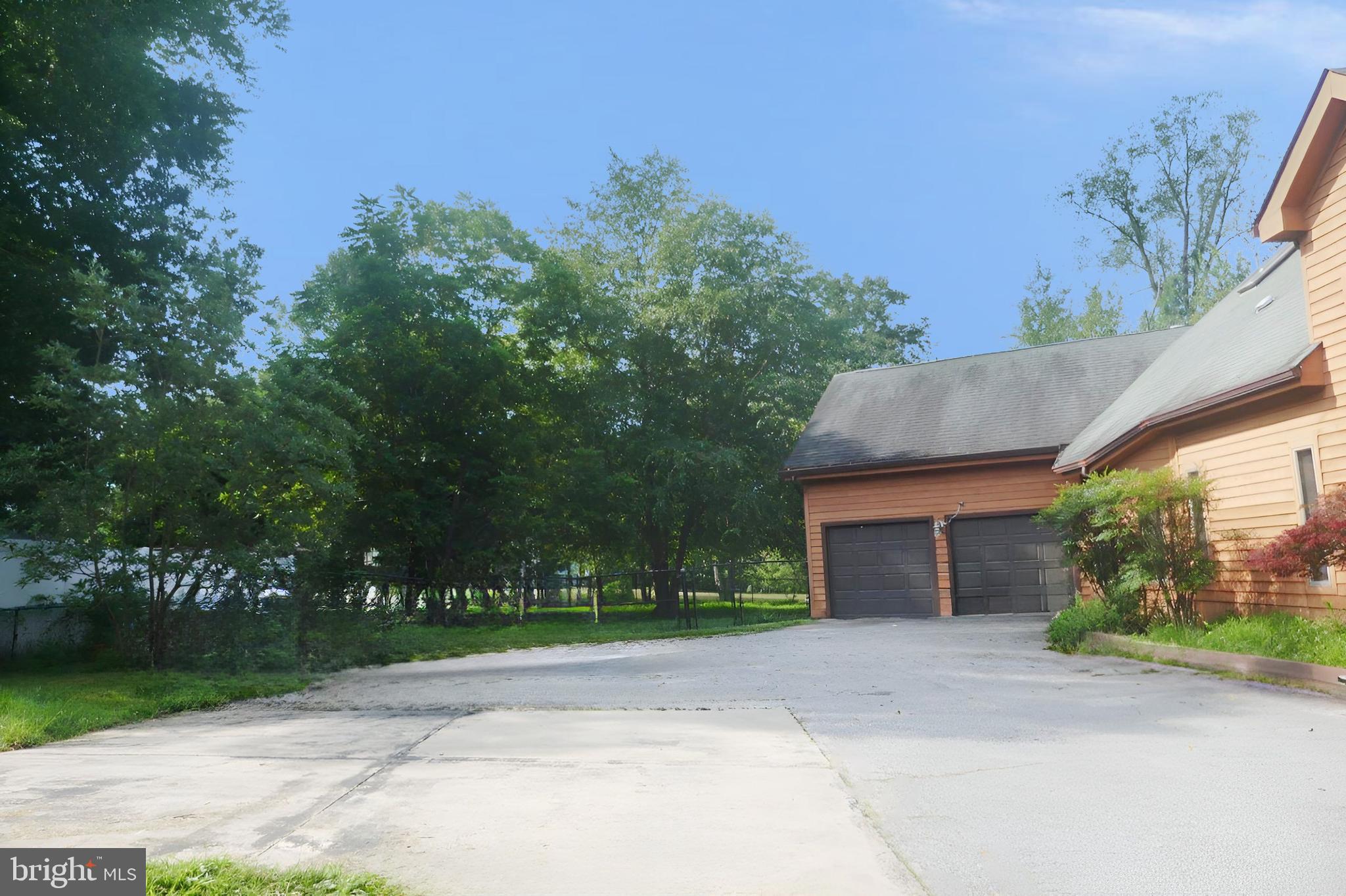 2519 Briggs Chaney Road Silver Spring, MD 20905 - Photo 3 of 10 front view of a house with a garden