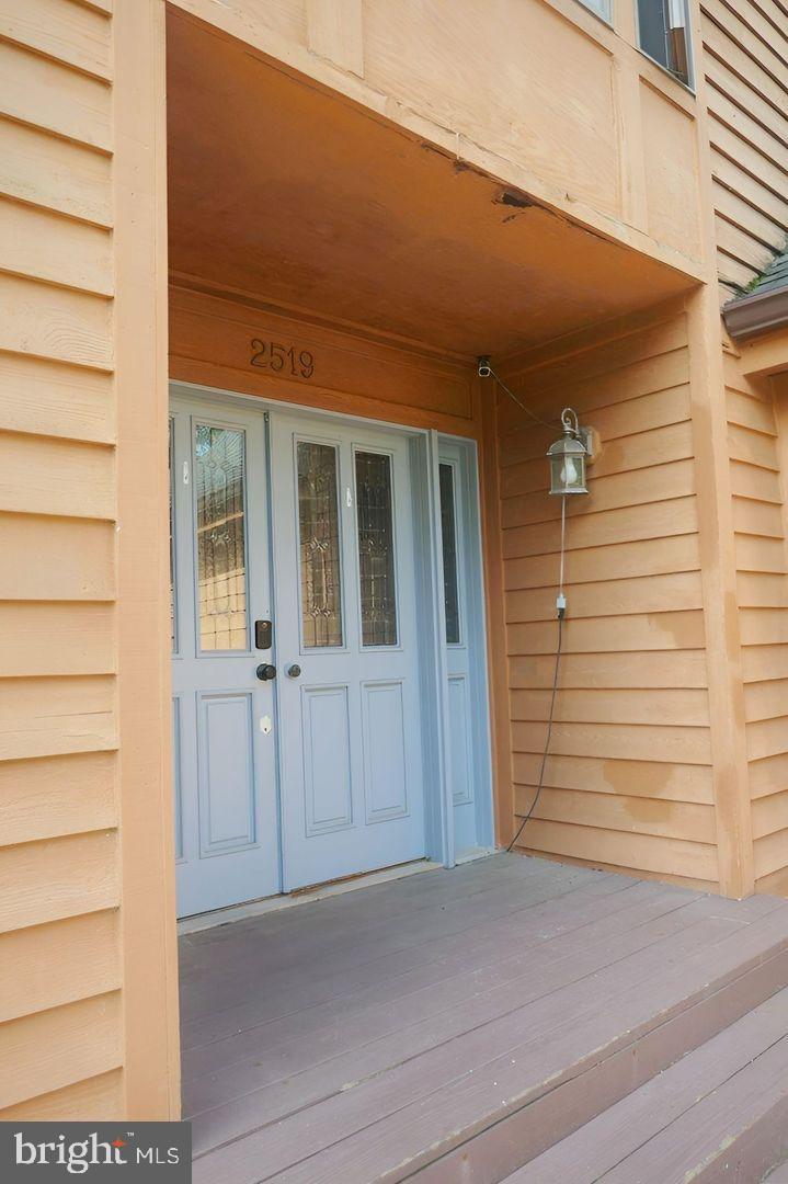2519 Briggs Chaney Road Silver Spring, MD 20905 - Photo 6 of 10 a view of a house with a door and wooden floor