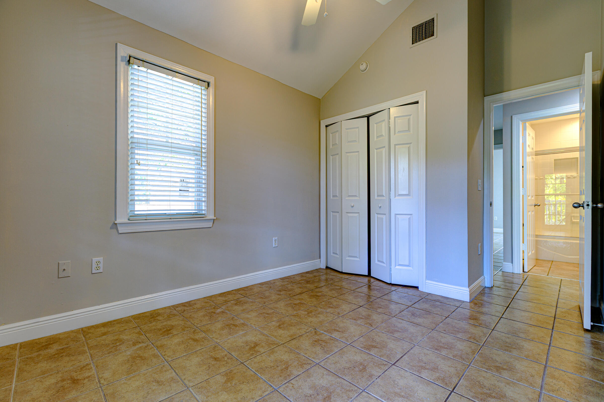 263 Golf Club Drive Key West, FL 33040 - Photo 21 of 30 a view of an empty room with window and a bathroom