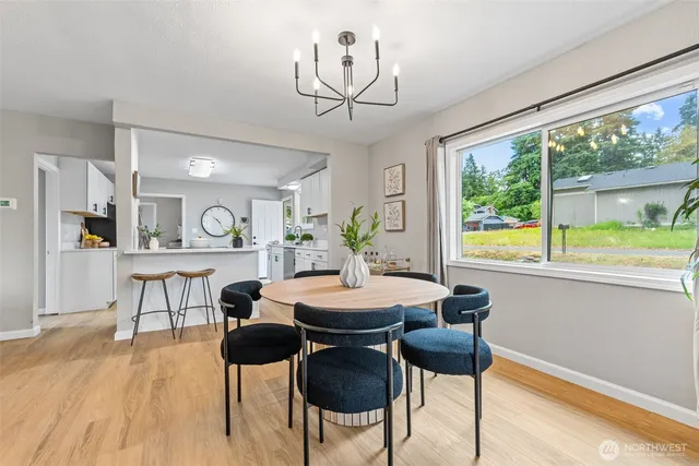 a view of a dining room with furniture window and outside view