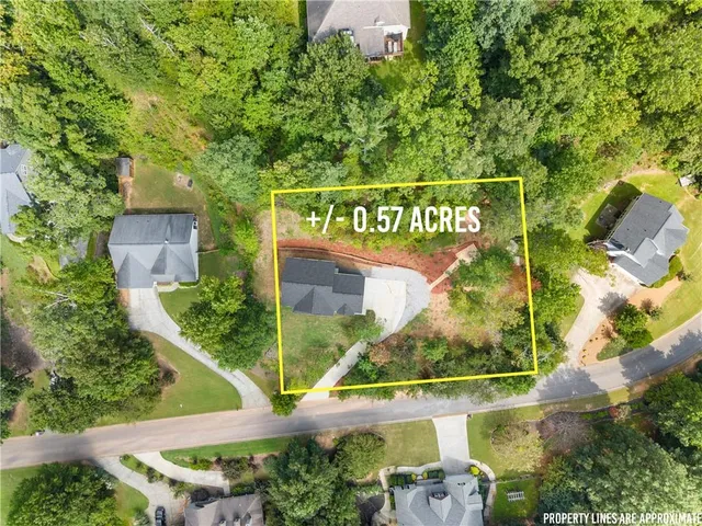 a view of a city with lush green forest