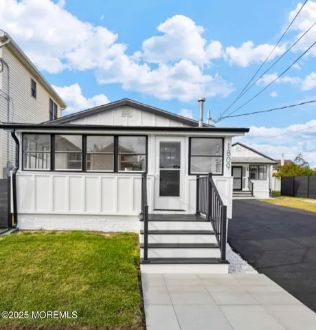 a view of room with window and hardwood floor