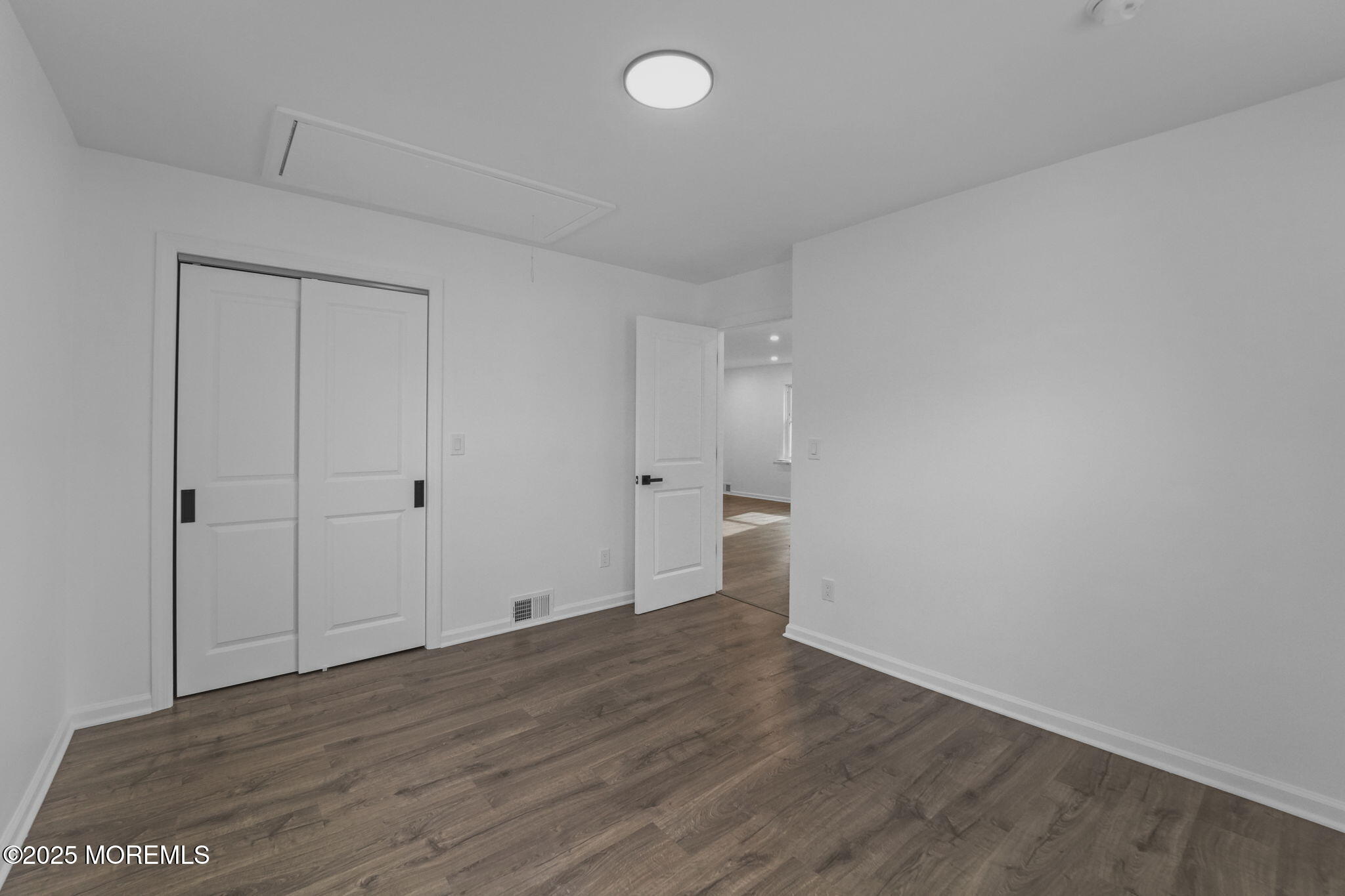 1807-1809 Laurel Terrace Belmar, NJ 07719 - Photo 10 of 20 a view of an empty room and wooden floor