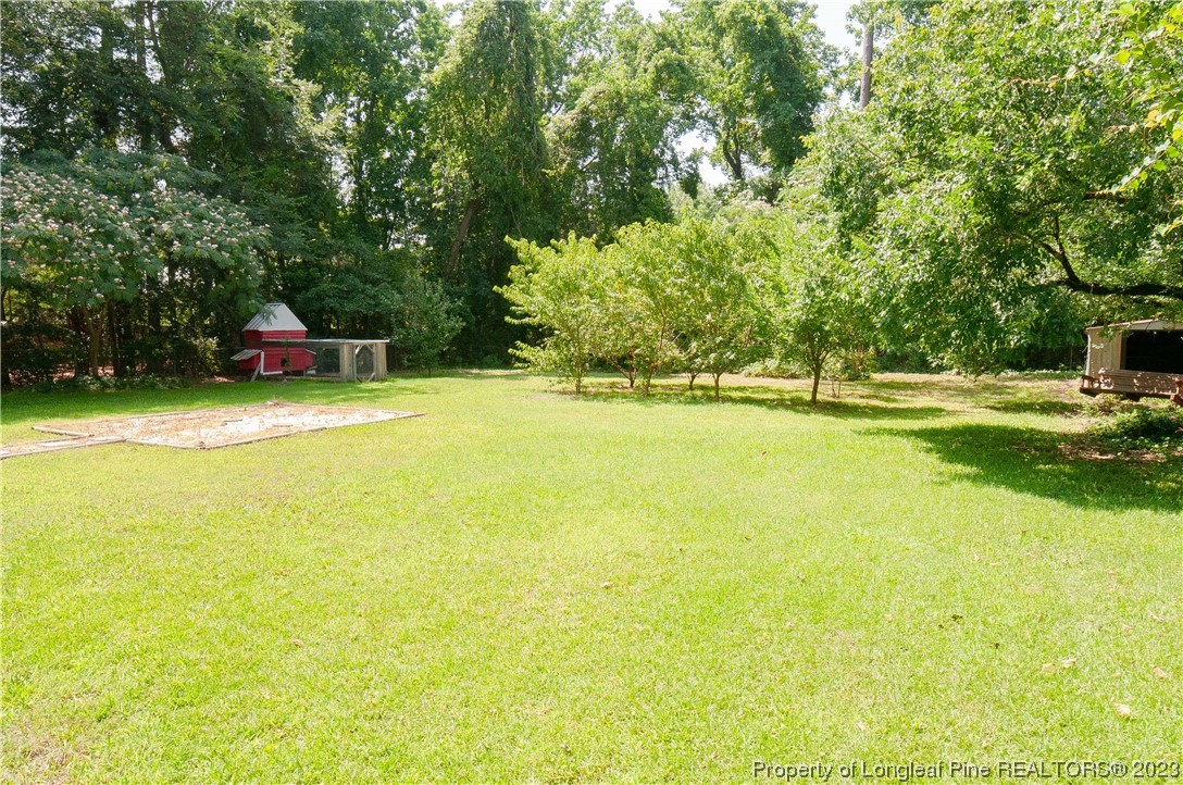4605 Nix Road Fayetteville, NC 28314 - Photo 14 of 48 a view of a swimming pool and a yard