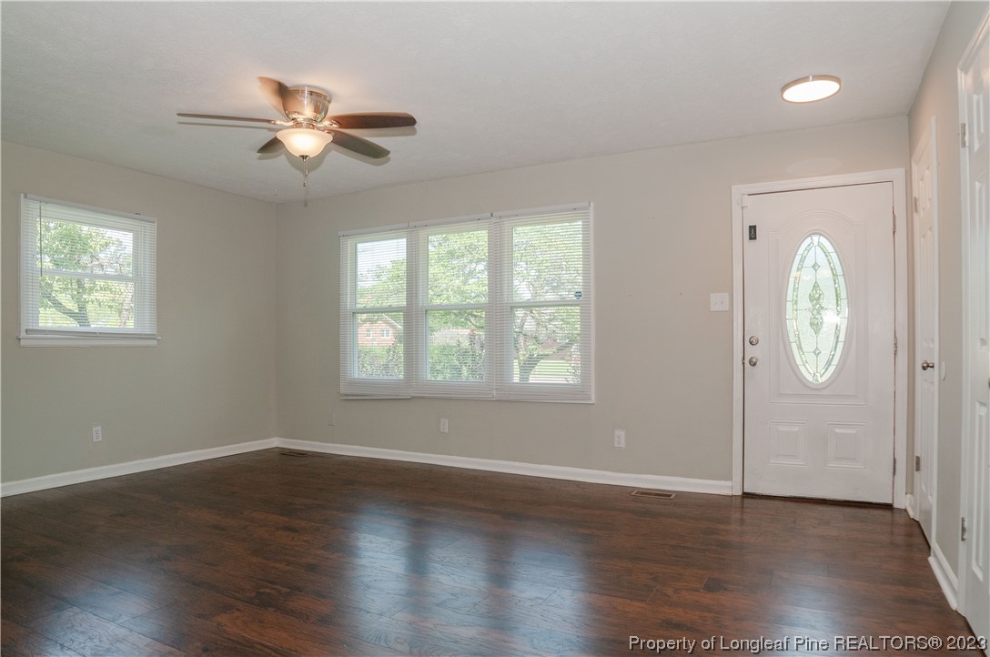 4605 Nix Road Fayetteville, NC 28314 - Photo 15 of 48 a view of an empty room with wooden floor and window