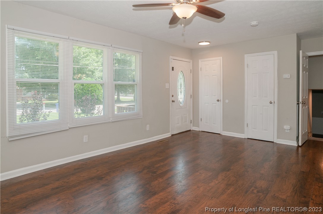 4605 Nix Road Fayetteville, NC 28314 - Photo 16 of 48 a view of an empty room with wooden floor and a window