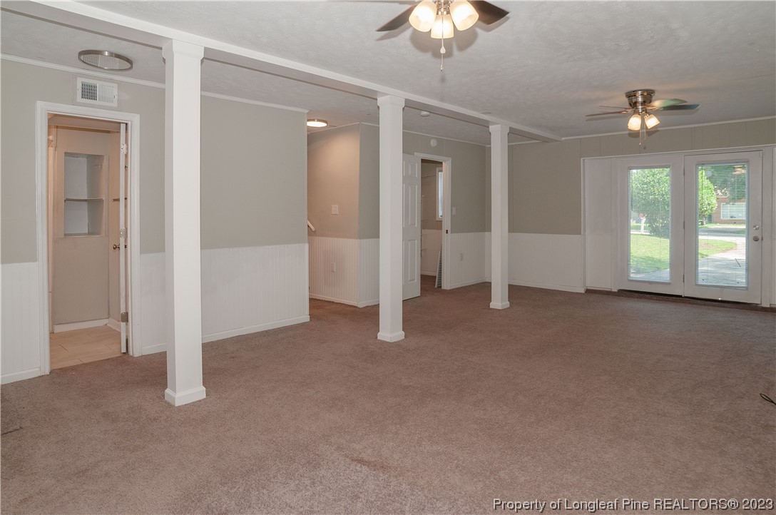 4605 Nix Road Fayetteville, NC 28314 - Photo 29 of 48 an empty room with chandelier fan and windows