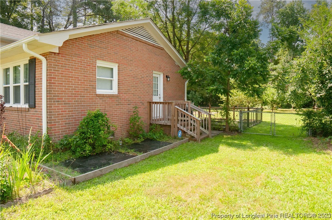 4605 Nix Road Fayetteville, NC 28314 - Photo 3 of 48 a view of a house with backyard and sitting area