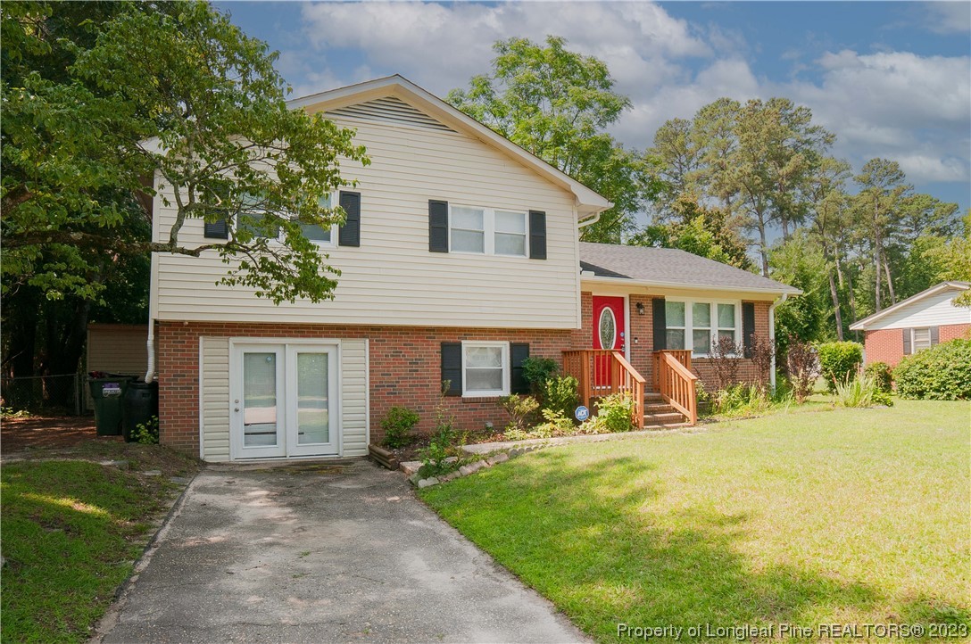 4605 Nix Road Fayetteville, NC 28314 - Photo 4 of 48 a front view of house with yard outdoor seating and green space