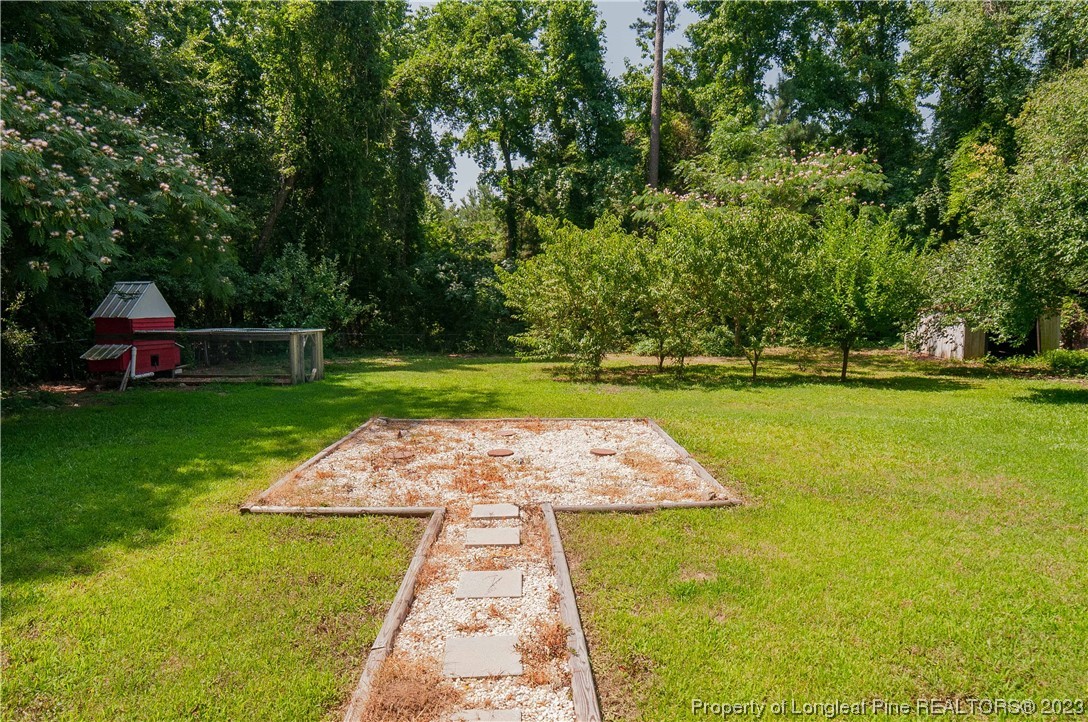 4605 Nix Road Fayetteville, NC 28314 - Photo 6 of 48 a view of a backyard with swimming pool