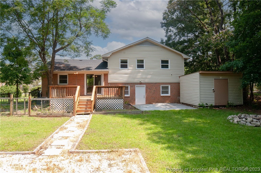4605 Nix Road Fayetteville, NC 28314 - Photo 7 of 48 a view of a house with a yard patio and a small yard