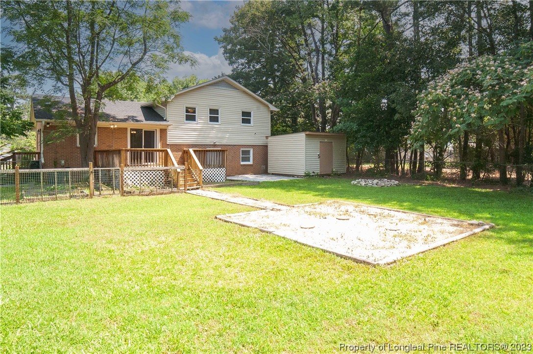 4605 Nix Road Fayetteville, NC 28314 - Photo 8 of 48 a front view of a house with a yard and trees