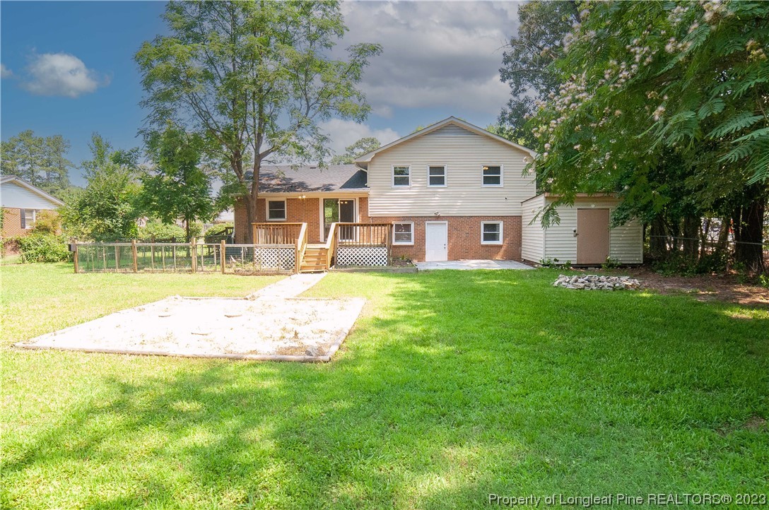 4605 Nix Road Fayetteville, NC 28314 - Photo 9 of 48 a front view of a house with a yard and trees