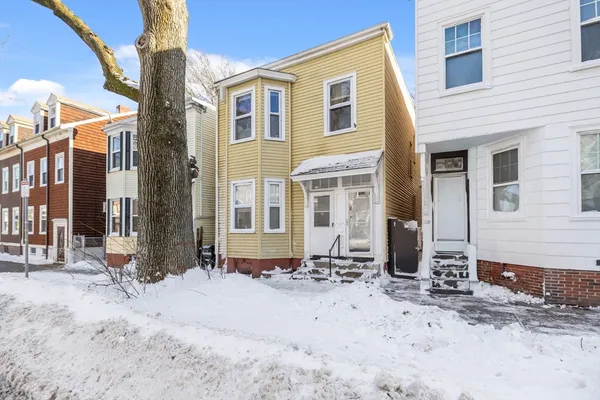 a front view of a house with a yard