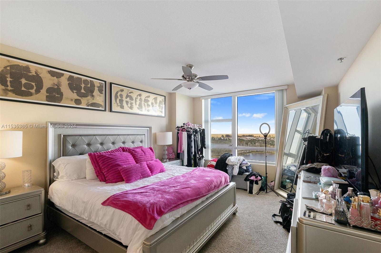 2681 North Flamingo Road, Unit 1405S Sunrise, FL 33323 - Photo 12 of 28 a bed room with a bed and a flat tv screen