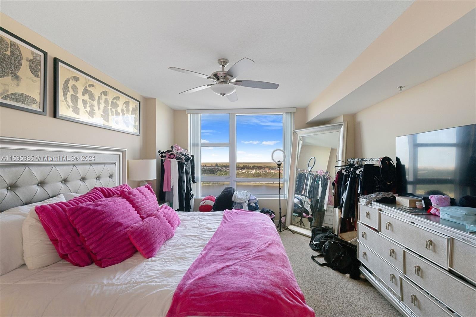 2681 North Flamingo Road, Unit 1405S Sunrise, FL 33323 - Photo 13 of 28 a bed room with a bed and a flat tv screen