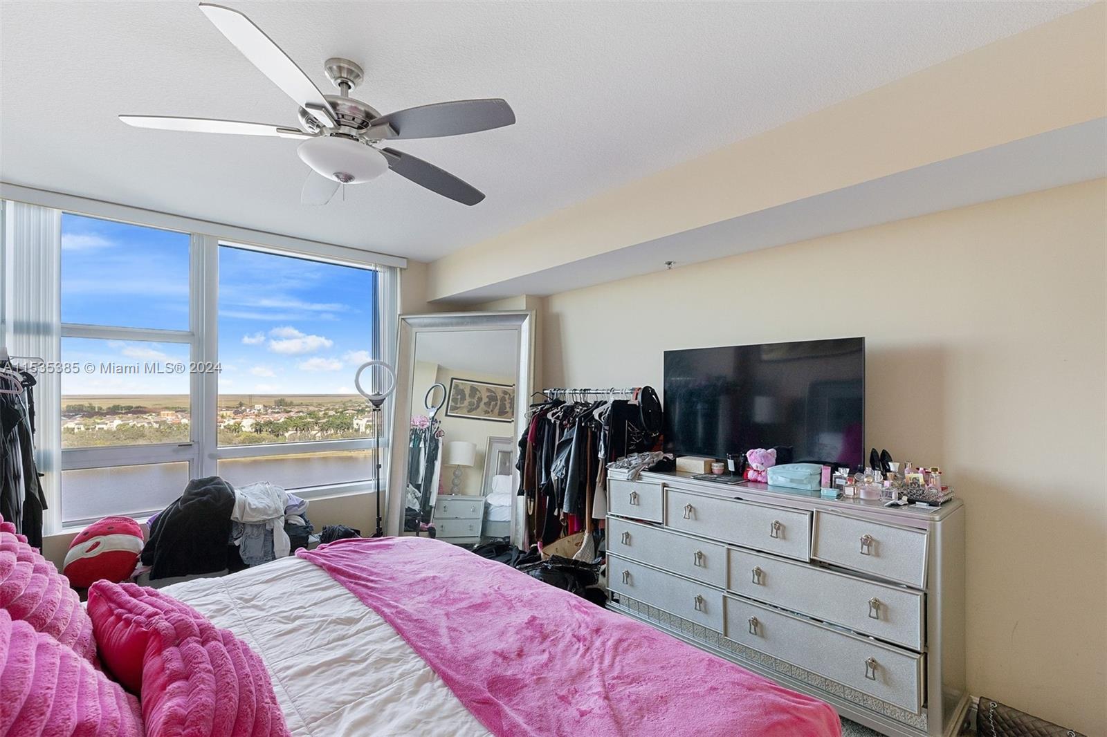 2681 North Flamingo Road, Unit 1405S Sunrise, FL 33323 - Photo 14 of 28 a bedroom with a bed television and a window