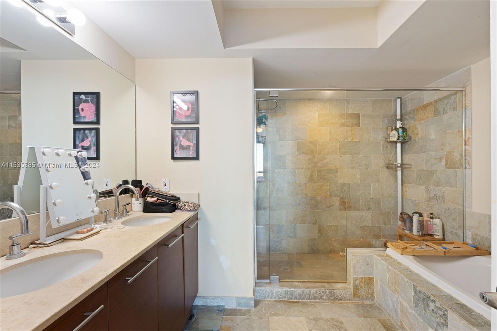 2681 North Flamingo Road, Unit 1405S Sunrise, FL 33323 - Photo 15 of 28 a bathroom with a sink and a mirror