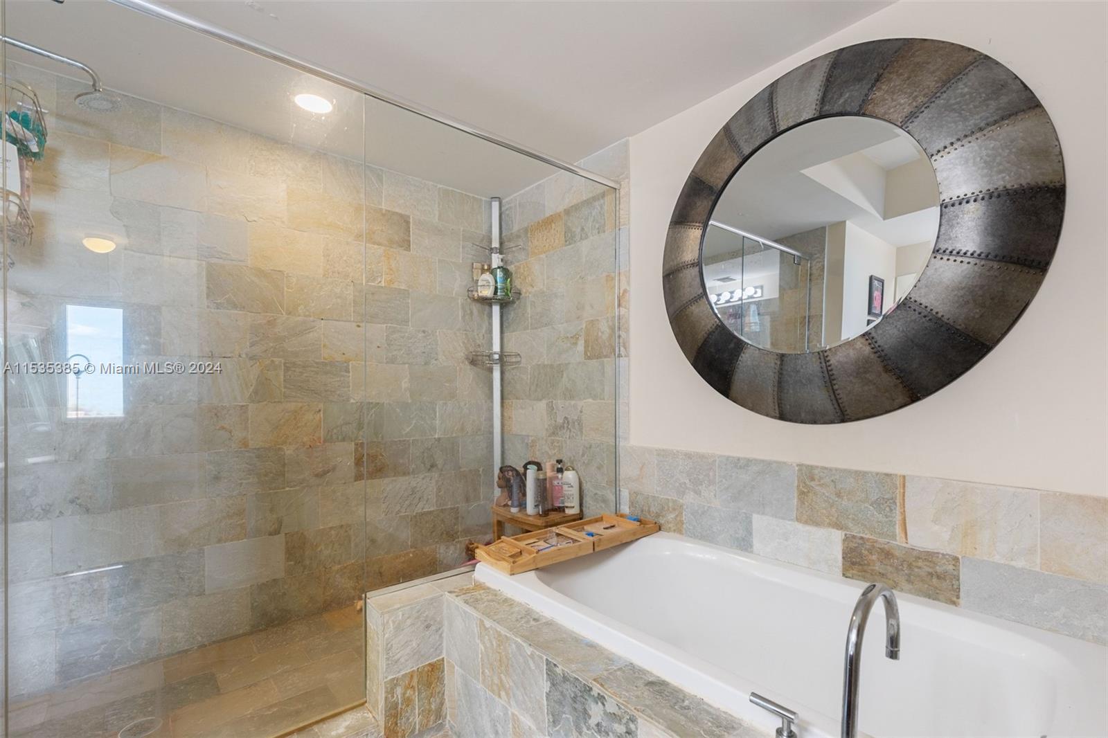 2681 North Flamingo Road, Unit 1405S Sunrise, FL 33323 - Photo 16 of 28 a bathroom with a sink and a mirror