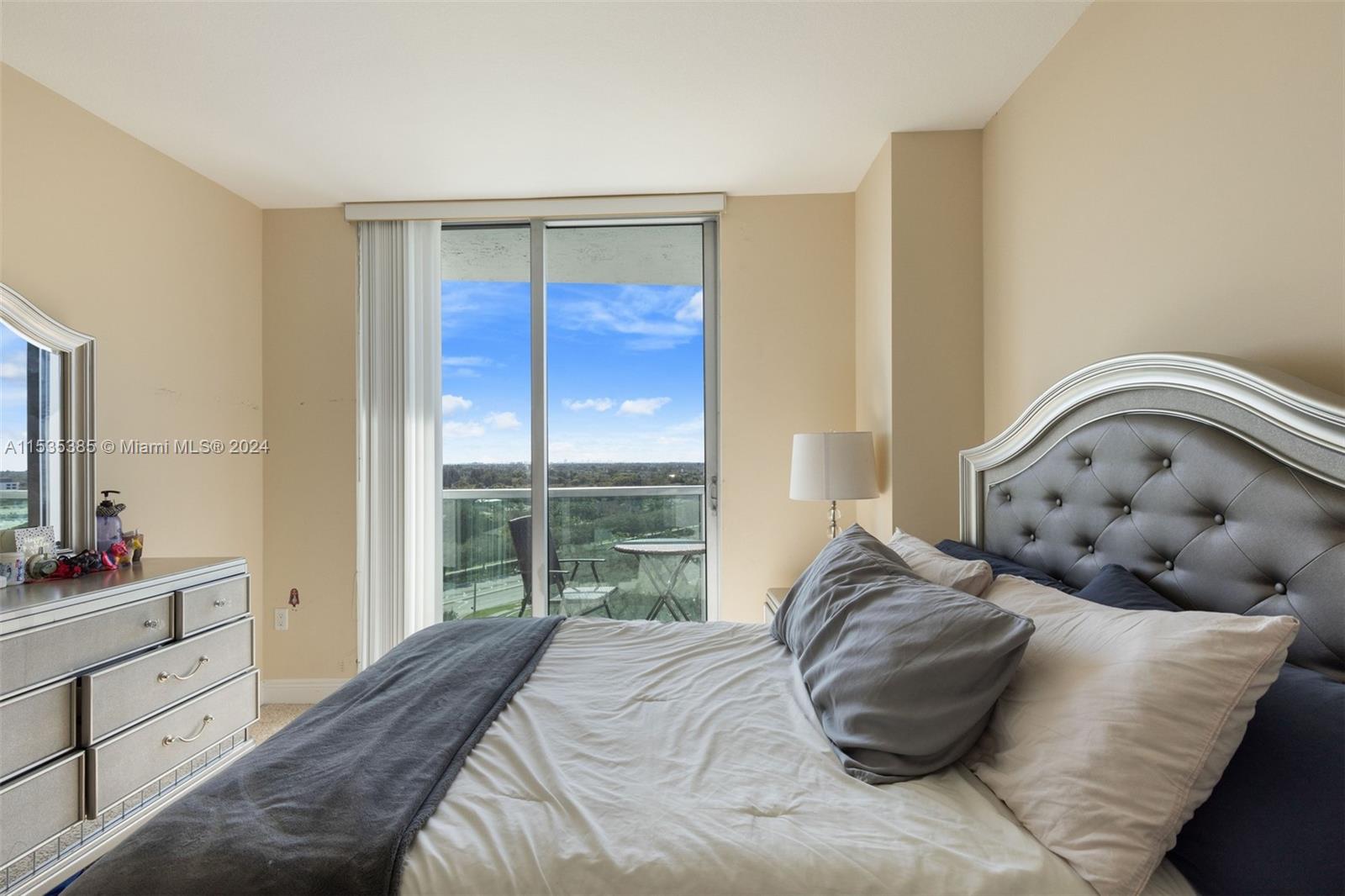 2681 North Flamingo Road, Unit 1405S Sunrise, FL 33323 - Photo 21 of 28 a bedroom with a bed and a window