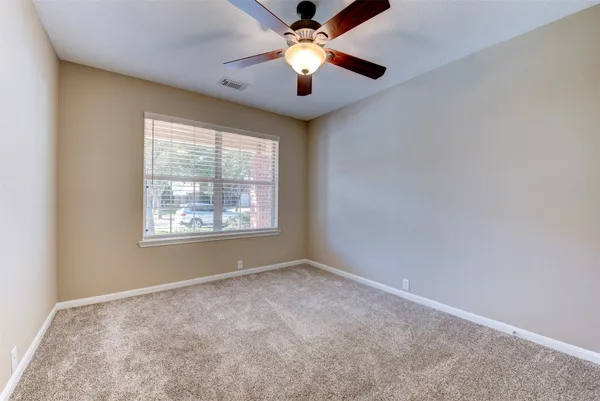 a view of an empty room with a yard