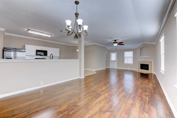 a view of a kitchen with a sink stove and refrigerator