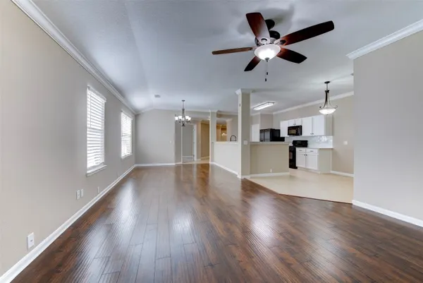 a large kitchen with kitchen island a sink stainless steel appliances and a window