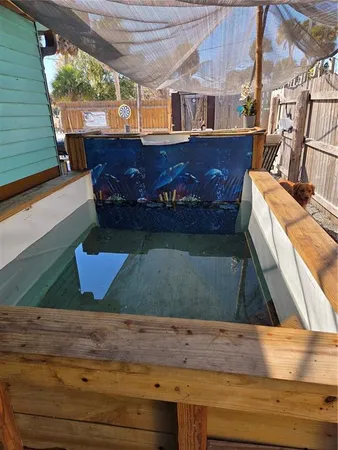 a view of swimming pool with outdoor seating