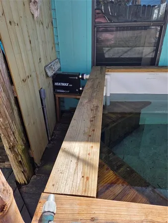 a view of a door with wooden floor