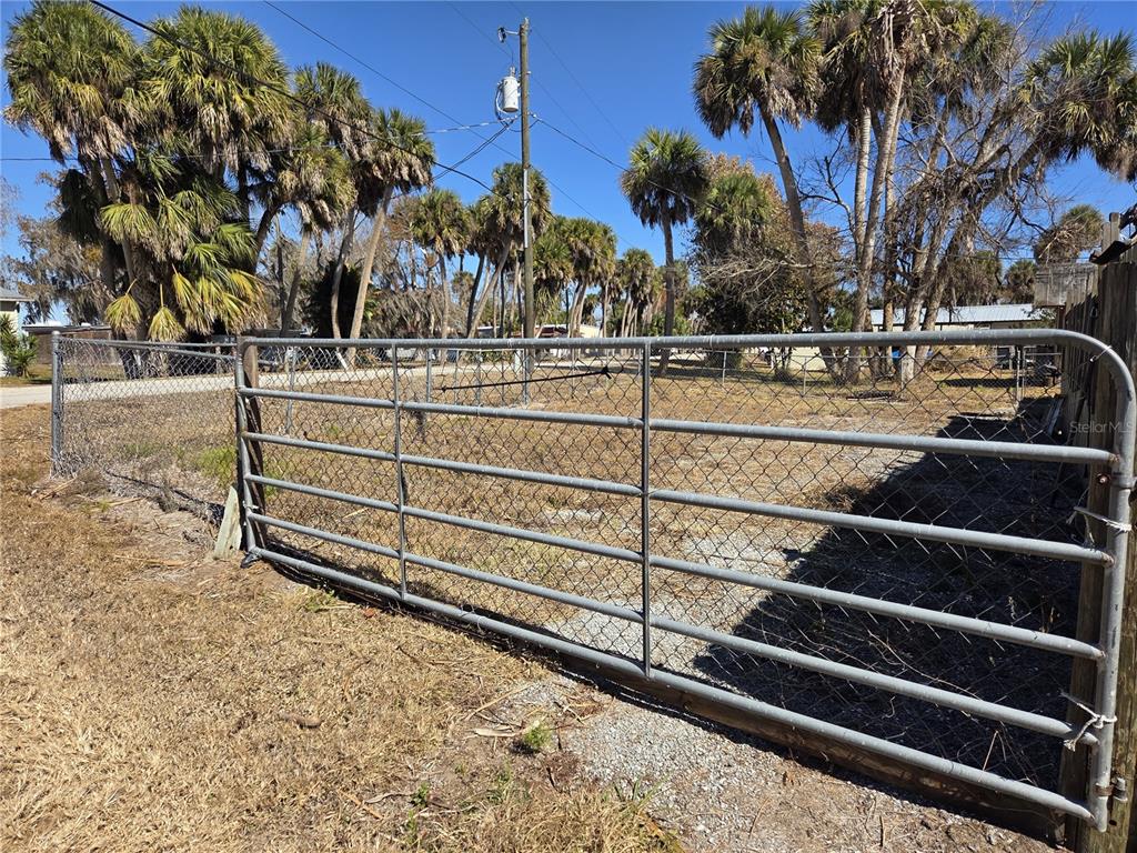 1024 Strickland Road Okeechobee, FL 34974 - Photo 21 of 23 a view of outdoor space with trees