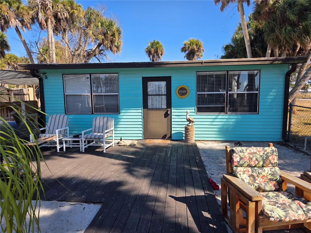 1024 Strickland Road Okeechobee, FL 34974 - Photo 3 of 23 a view of a house with a patio