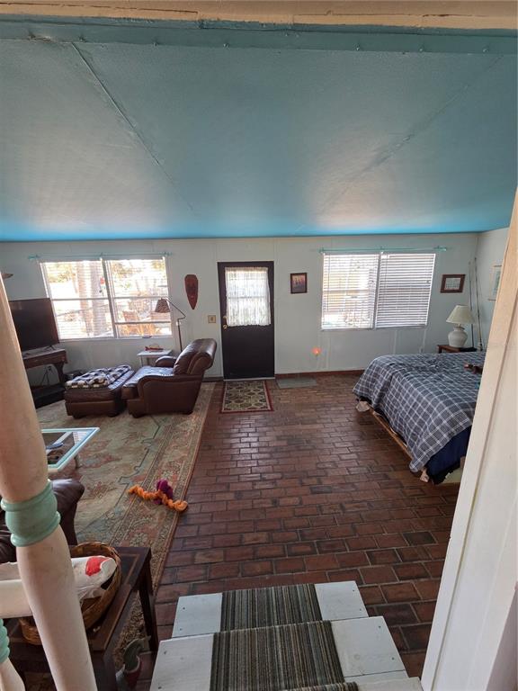 1024 Strickland Road Okeechobee, FL 34974 - Photo 5 of 23 a bedroom with furniture and a window