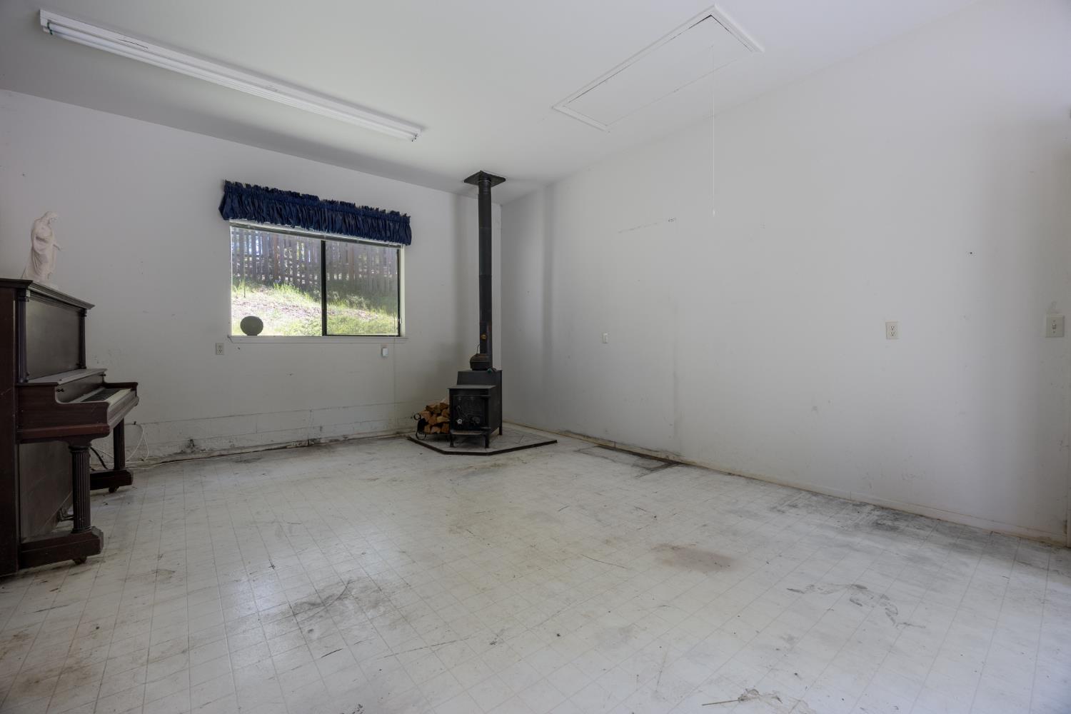 2070 King Of The Mountain Road Pollock Pines, CA 95726 - Photo 20 of 53 an empty room with windows