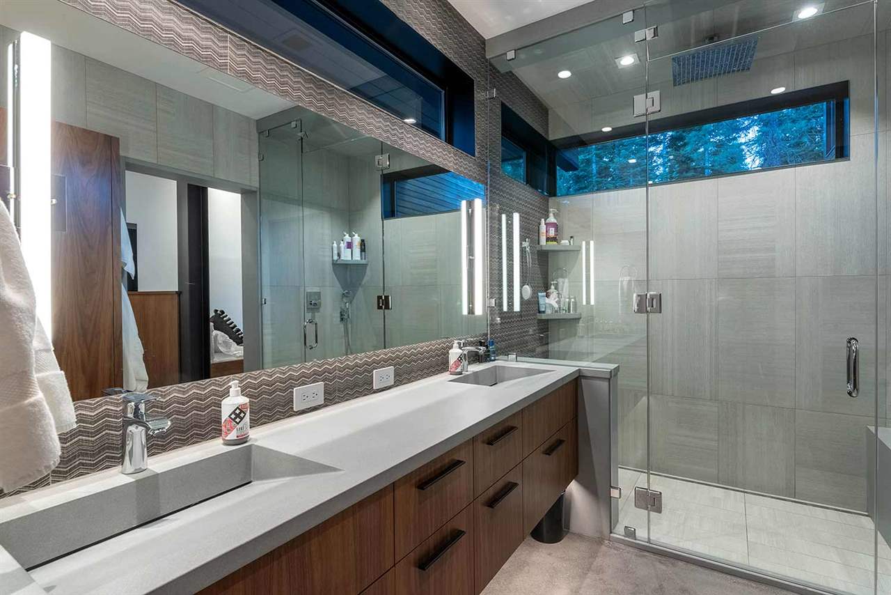 10629 Carson Range Road Truckee, CA 96161 - Photo 12 of 21 a bathroom with a double vanity sink mirror and shower
