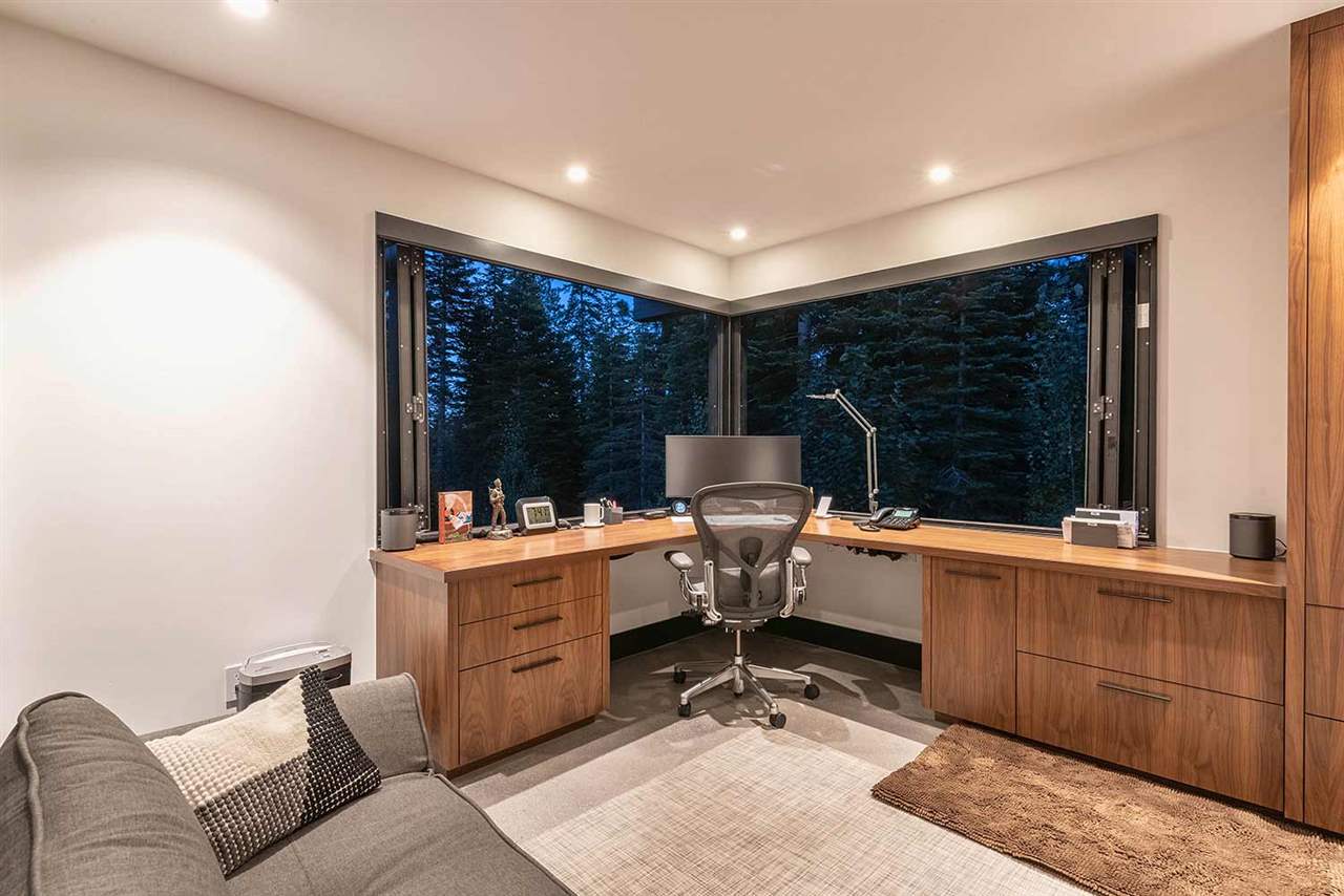 10629 Carson Range Road Truckee, CA 96161 - Photo 15 of 21 a work room with furniture a rug and white walls