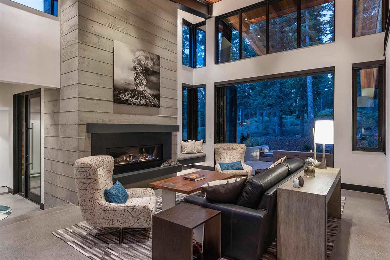 10629 Carson Range Road Truckee, CA 96161 - Photo 2 of 21 a living room with furniture and a fireplace