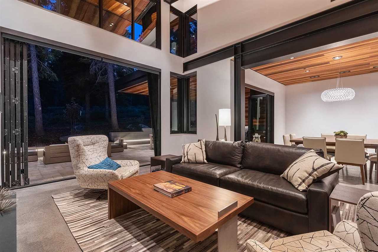 10629 Carson Range Road Truckee, CA 96161 - Photo 3 of 21 a view of a patio with couches and a table and chairs with garden view