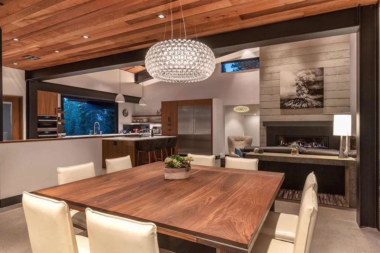 10629 Carson Range Road Truckee, CA 96161 - Photo 5 of 21 a dining table with chairs and chandelier