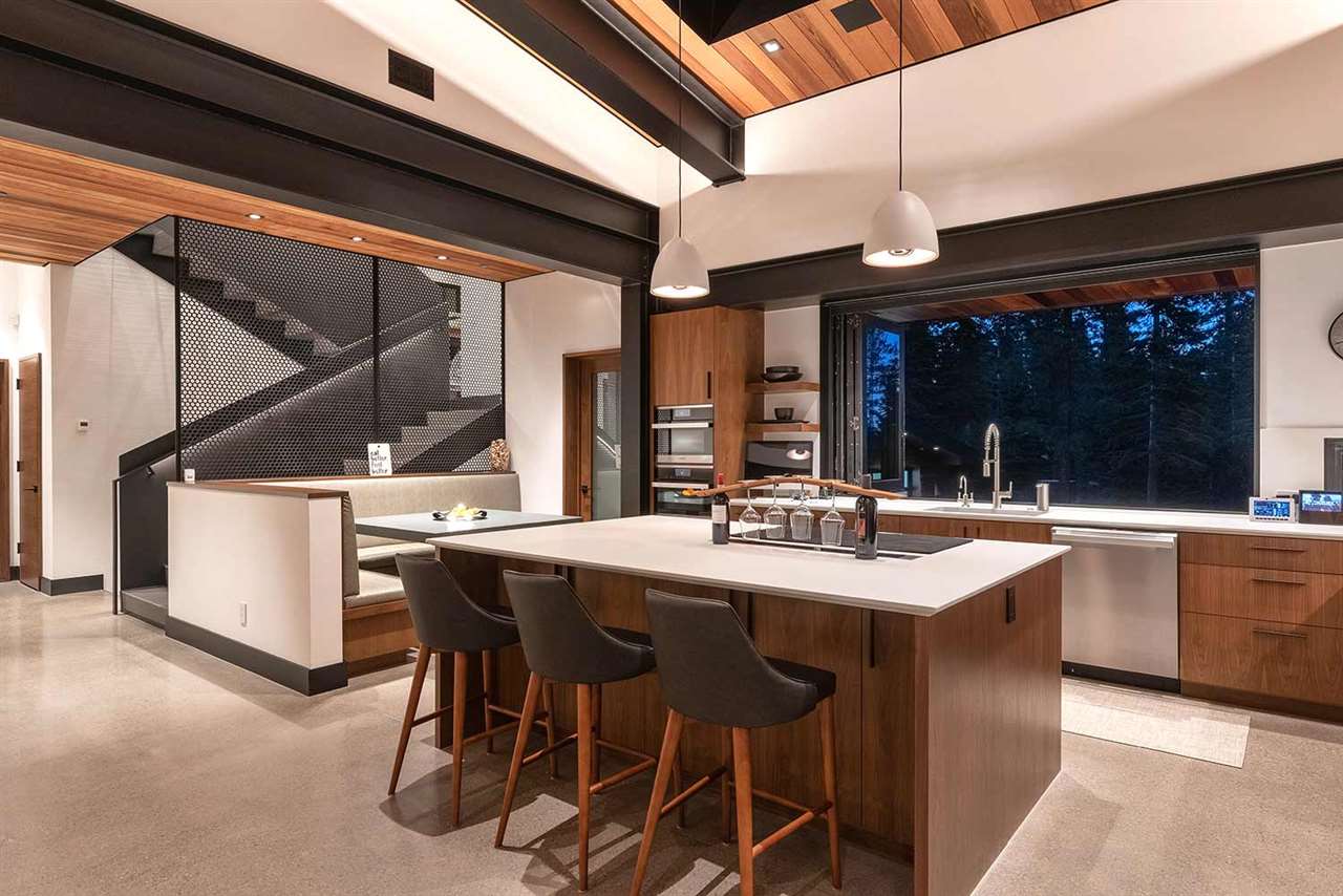 10629 Carson Range Road Truckee, CA 96161 - Photo 7 of 21 a kitchen with stainless steel appliances a sink table and chairs