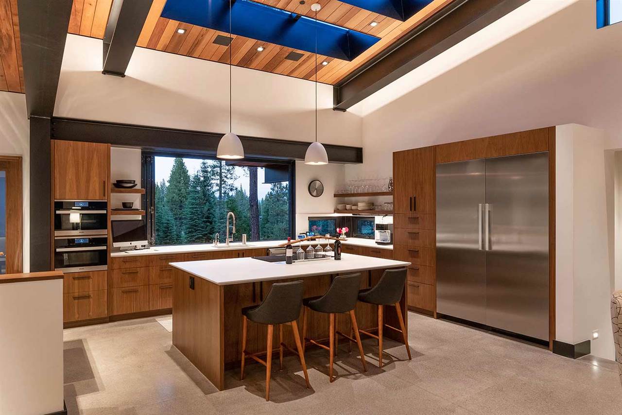 10629 Carson Range Road Truckee, CA 96161 - Photo 8 of 21 a kitchen with stainless steel appliances granite countertop a stove top oven a sink and a refrigerator