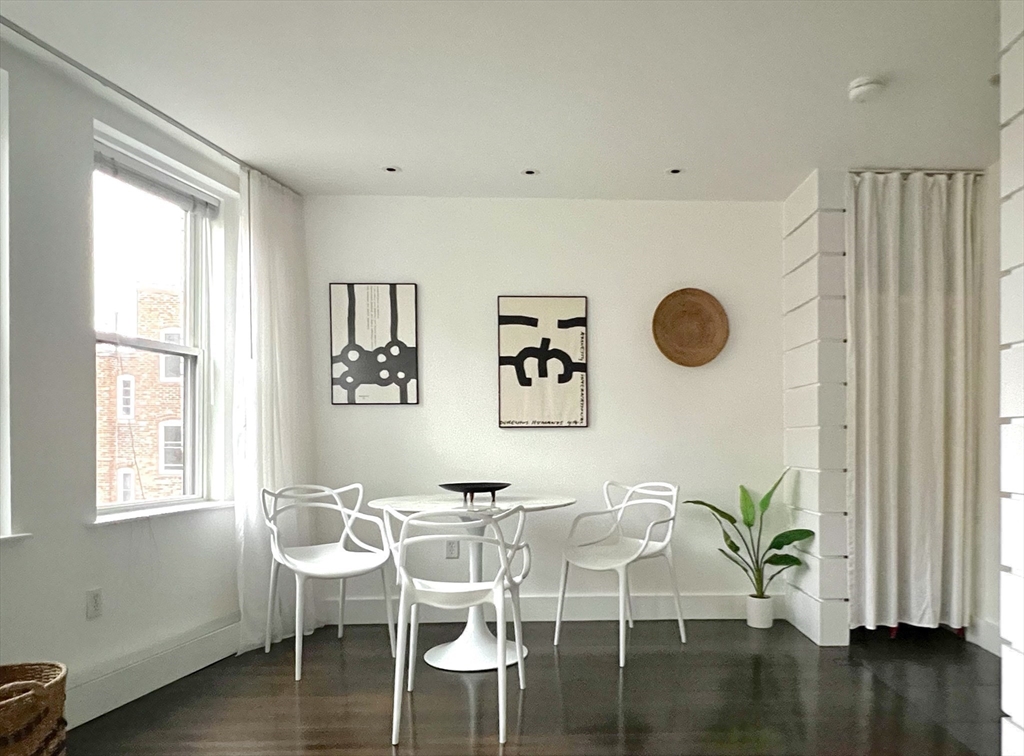 15 Charter Street, Unit 4 Boston, MA 02113 - Photo 11 of 42 a view of a dining room with furniture and wooden floor