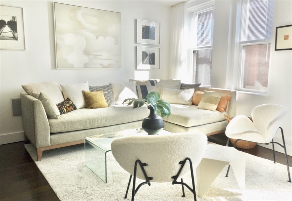 15 Charter Street, Unit 4 Boston, MA 02113 - Photo 12 of 42 a living room with furniture and a couch